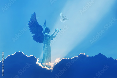 Fototapeta Beautiful angel in heaven with divine rays of sun light