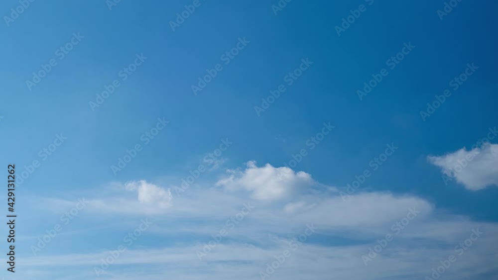 Timelapse of moving white clouds with blue sky.Cloud moving and transforming footage background. Timelapse of moving white clouds with blue sky.Cloud moving and transforming footage background.