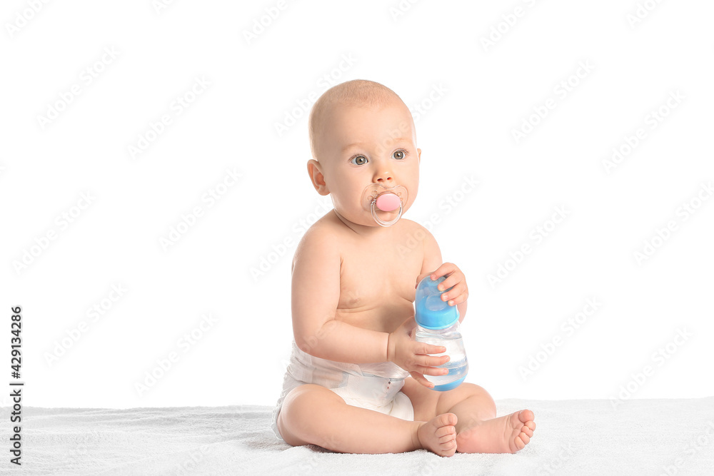 Cute little baby with bottle of water on white background Cute little baby with bottle of water on white background