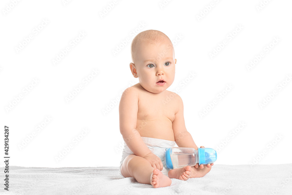 Cute little baby with bottle of water on white background Cute little baby with bottle of water on white background