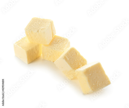 Cubes of fresh butter on white background