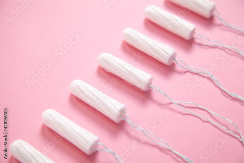 Menstrual tampon on a pink background.