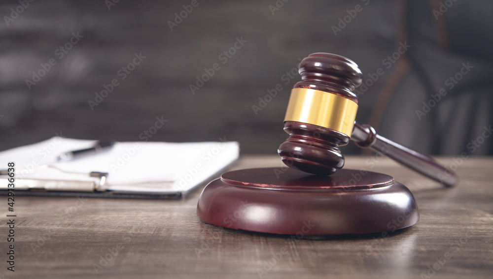 Obraz premium Judge gavel and document on the table. Law concept