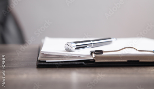 Contract and pen on the desk. Business concept