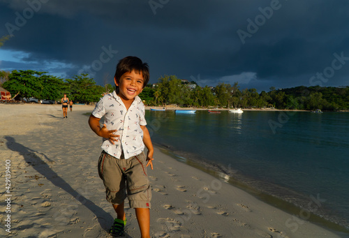 child playing on the beach