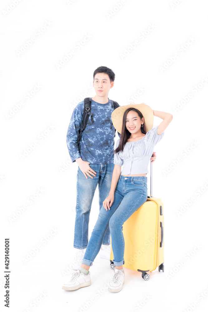 Young couple packing for vacation travel on isolated white background. Young Asian Male and female are preparing for the journey happily on white background. Young couple packing for vacation travel on isolated white background. Young Asian Male and female are preparing for the journey happily on white background.