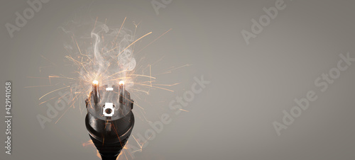 Photos Faulty power plug with flying sparks and smoke