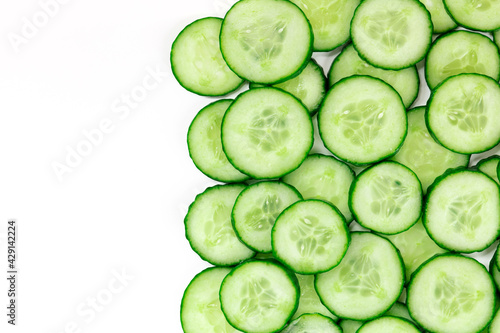 Cucumber slices, shot from the top on a white background