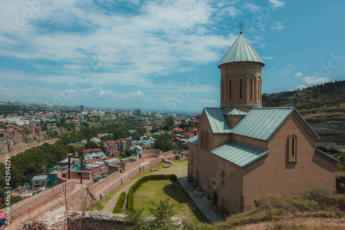 Narikala fortress above the city of Tbilisi, Georgia. Looking towards the st. Nicholas church, dating from the 13th century, photo on a sunny day in summer.