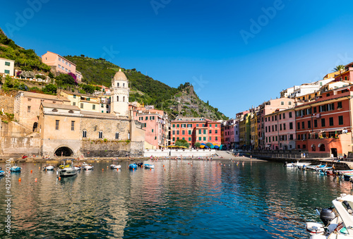 Vernazza, Liguria,Italy. The small port of this characteristic seaside village is characterized by the colorful houses that overlook the sea and the hill immediately behind. Famous tourist destination