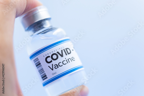 Close up Vaccine concept in the hand of doctor white vaccine jar with copy space. Vaccine Concept of the fight against coronavirus, immunization, and treatment, medical concept, 