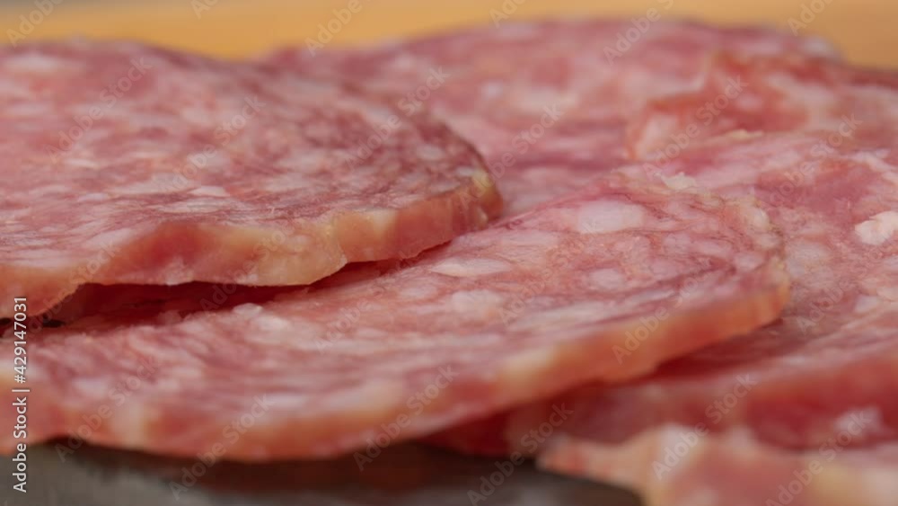 sliced sausages rotation. Sliced salami rotates. Smoked sausage slices. Salami Rotating. Sausage isolated. sliced sausages rotation. Sliced salami rotates. Smoked sausage slices. Salami Rotating. Sausage isolated.