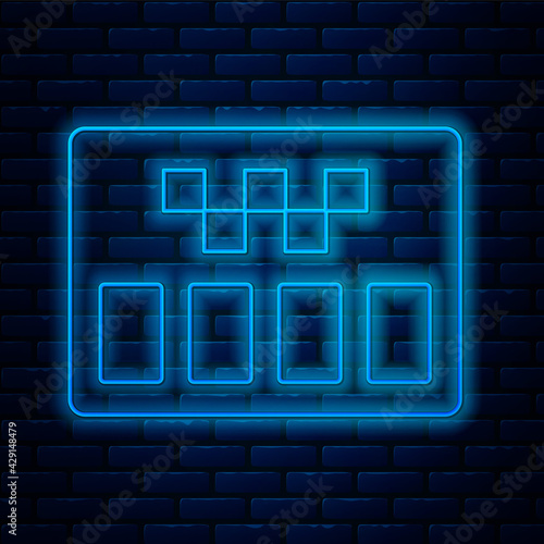 Glowing neon line Taximeter device icon isolated on brick wall background. Measurement appliance for passenger fare in taxi car. Vector