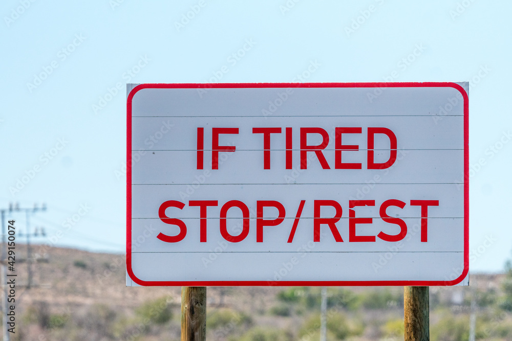 Driver fatigue road sign concept road safety on long haul journeys Driver fatigue road sign concept road safety on long haul journeys
