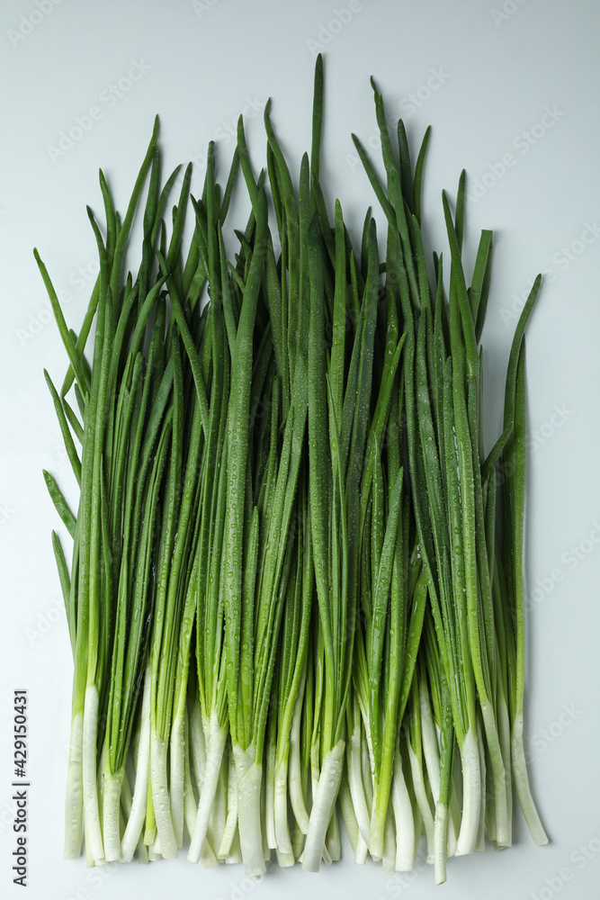 Fresh green onion with water drops on white background Fresh green onion with water drops on white background