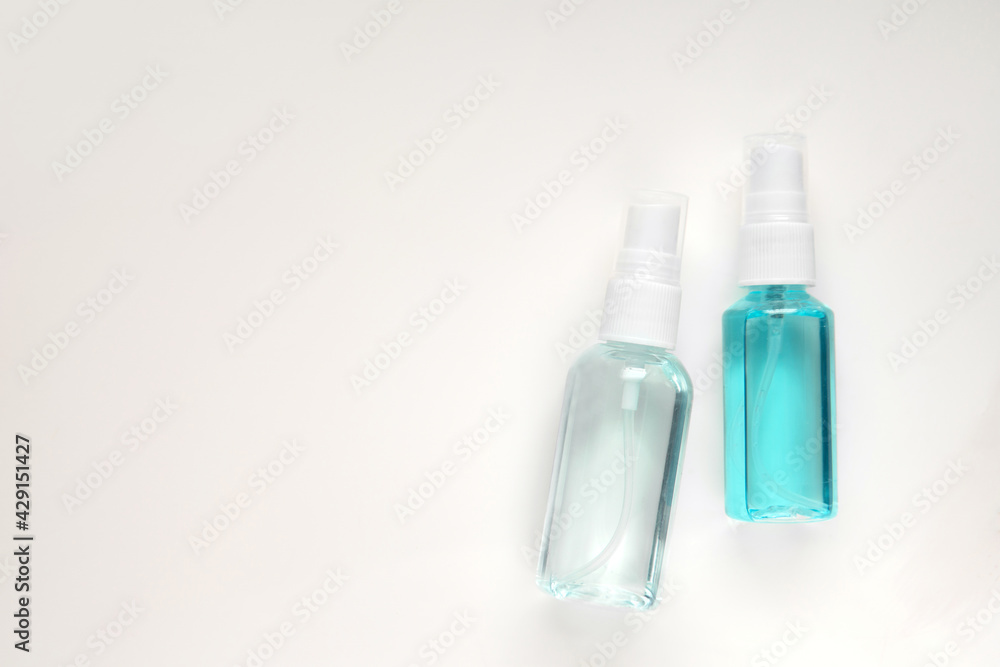 Top view above hand sanitizer spray bottle blue Isopropyl alcohol liquid for medical purpose and Anti coronavirus COVID-19 (Ethanol or ethyl alcohol on isolated white grey background with copy space Top view above hand sanitizer spray bottle blue Isopropyl alcohol liquid for medical purpose and Anti coronavirus COVID-19 (Ethanol or ethyl alcohol on isolated white grey background with copy space