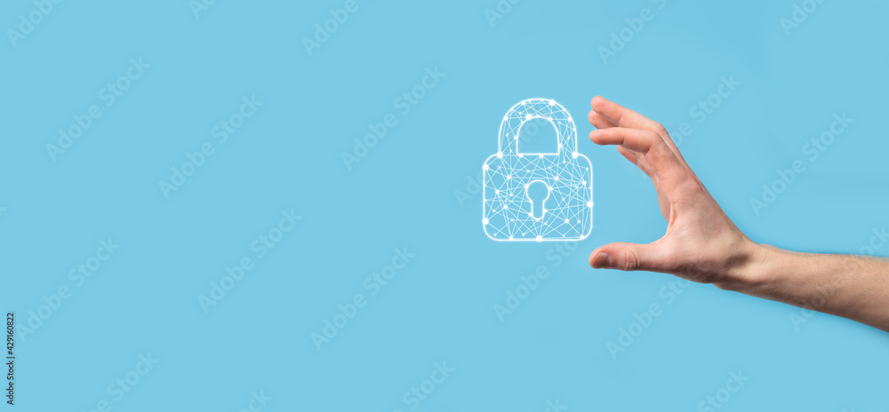 Male hand holding a lock padlock icon.Cyber security network. Internet technology networking.Protecting data personal information on tablet. Data protection privacy concept. GDPR. EU.Banner Male hand holding a lock padlock icon.Cyber security network. Internet technology networking.Protecting data personal information on tablet. Data protection privacy concept. GDPR. EU.Banner