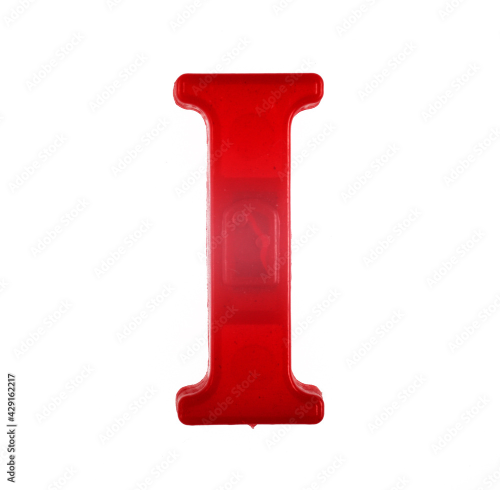 Plastic letter I of the English alphabet against white background, top view.