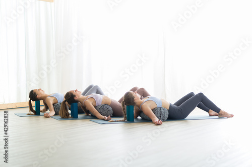Fotografi Restorative yoga with a bolster