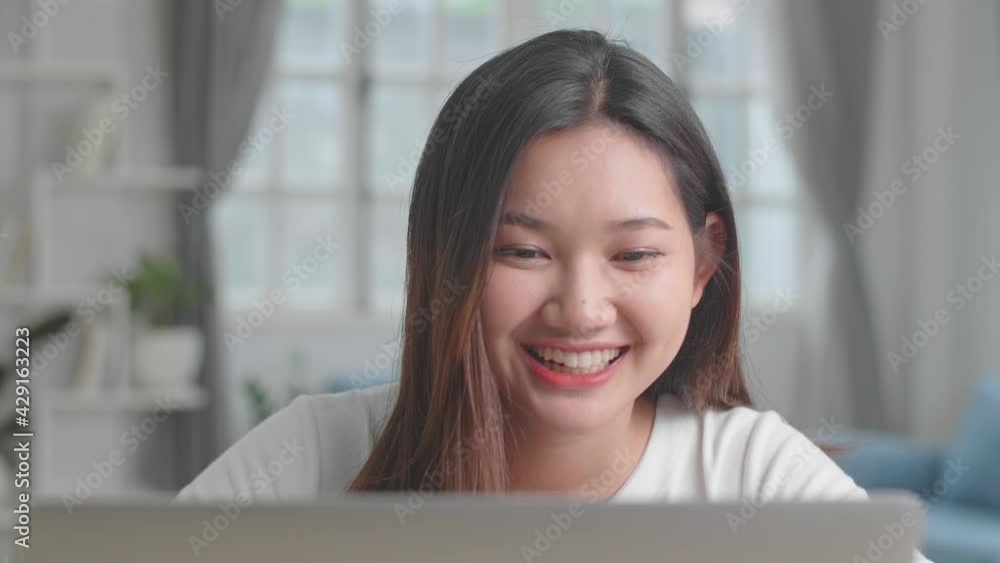 Asian Girl Smiling And Having Video Call On Laptop At Home
Asian Girl Smiling And Having Video Call On Laptop At Home
