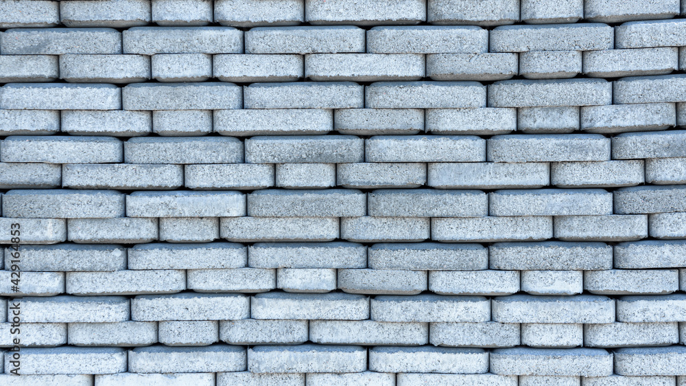 Background of sidewalk tiles. The paving tiles are stacked in rows and create a beautiful flat background. Background of sidewalk tiles. The paving tiles are stacked in rows and create a beautiful flat background.