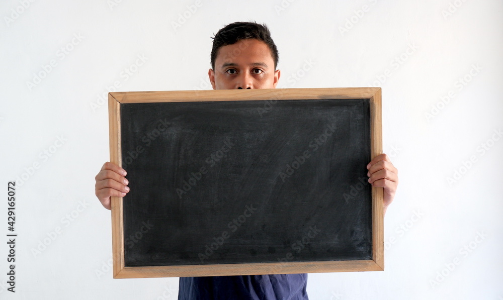 man holding blank blackboard