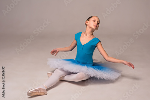 Ballerina in a ballet tutu and pointe shoes. The child ballerina is dancing. Girl on isolate © Hanna