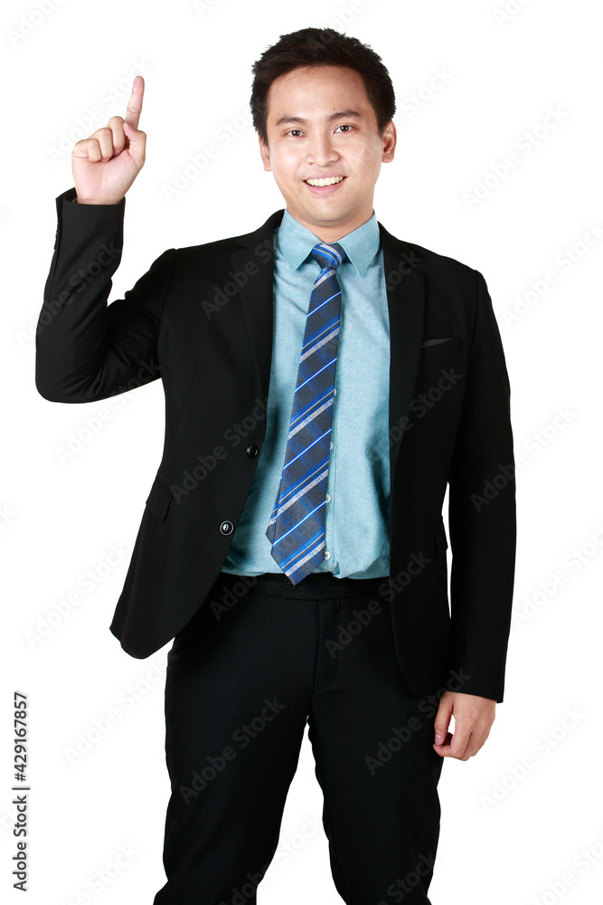 Portrait of Young Asian man smiling standing wearing black suit and showing finger point up in white background. Concept businessman success copy space. Portrait of Young Asian man smiling standing wearing black suit and showing finger point up in white background. Concept businessman success copy space.