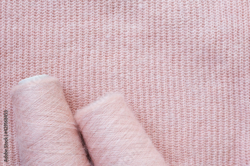 Background texture of pink pattern knitted fabric made of angora or wool.