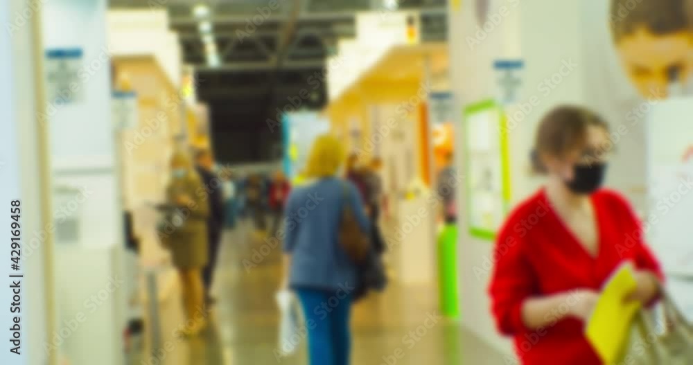 Business theme background. Unrecognizable people in a large and bright business center. Blurry defocused video. Business theme background. Unrecognizable people in a large and bright business center. Blurry defocused video.