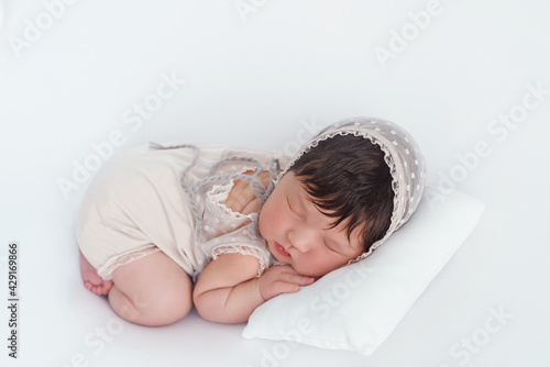 Little adorable newborn baby  sleeping at home after hospital.   Studio shot of newborn baby. Beginning of life. Bear toy