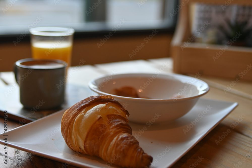 delicious freshly baked croissant. continental breakfast with croissant, coffee, juice and ham. delicious breakfast. delicious freshly baked croissant. continental breakfast with croissant, coffee, juice and ham. delicious breakfast.