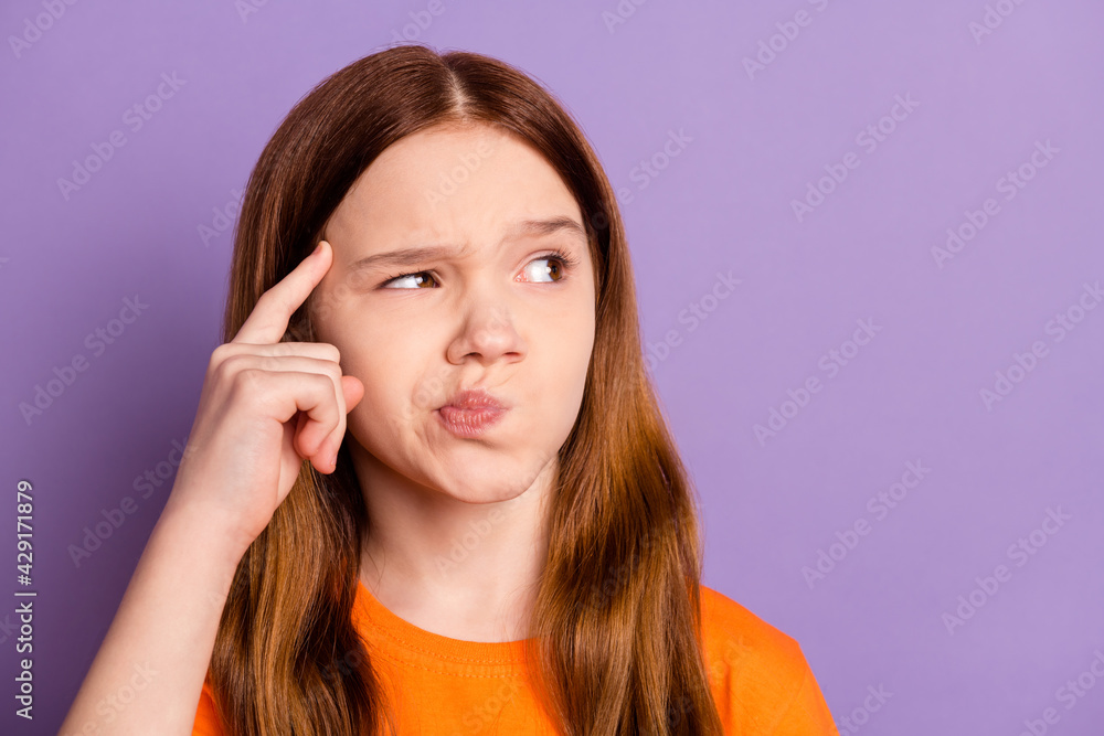 Close-up portrait of attractive minded suspicious girl solving making decision isolated over violet purple color background Close-up portrait of attractive minded suspicious girl solving making decision isolated over violet purple color background