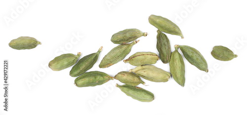 Green cardamom pods pile isolated on white background, top view
