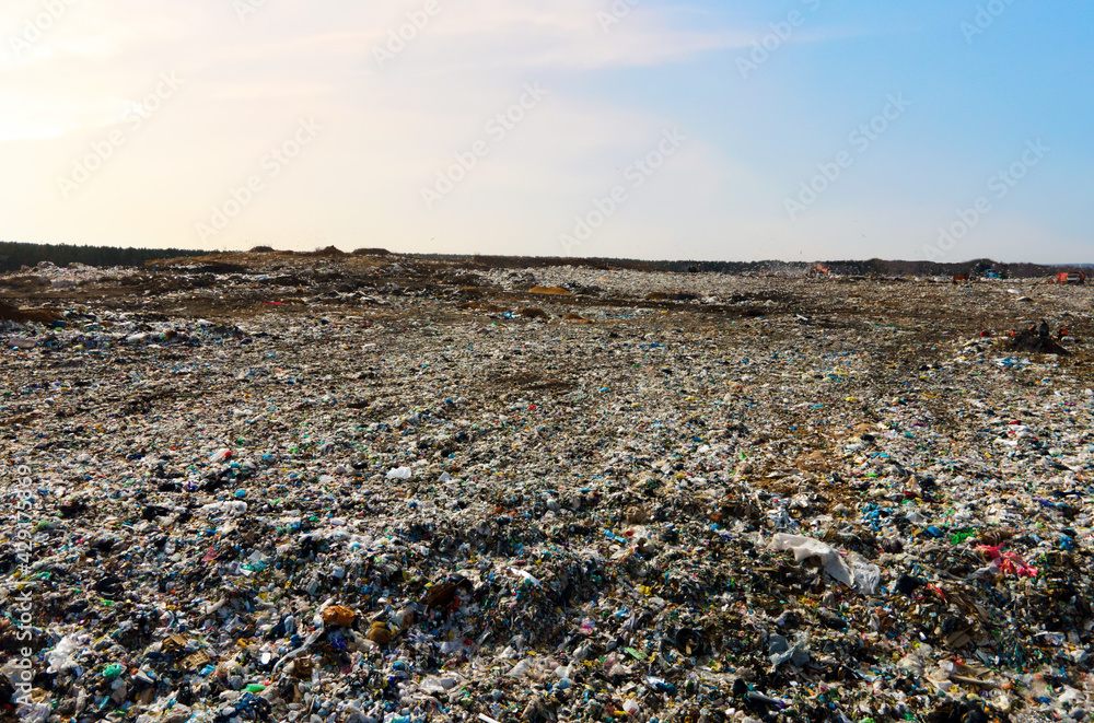 Garbage dump with plastic bags and food waste. Recycling of waste on junk yard. Dispose the rubbish in landfill. Trash disposal and rubbish dump with polution. Ecology, refuse and natural resources