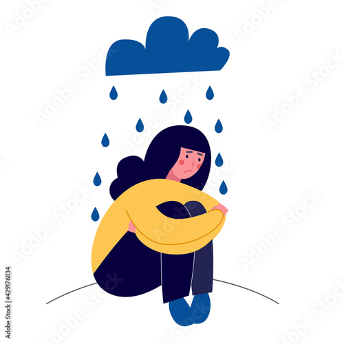 The girl sitting in the rain. She is sad and depressive