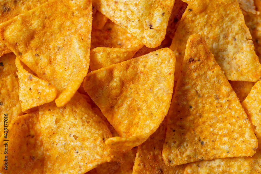 Mexican Corn Chips triangle-shaped nachos with cheese flavor close-up