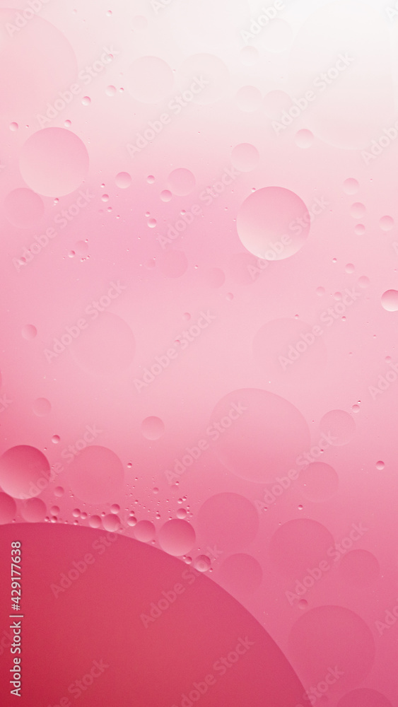 oil with air bubbles on coral background. Pink Abstract space background. Soft selective focus. macro of oil drops on water surface. copy space. air bubbles in water. Close-up and flat lay style oil with air bubbles on coral background. Pink Abstract space background. Soft selective focus. macro of oil drops on water surface. copy space. air bubbles in water. Close-up and flat lay style