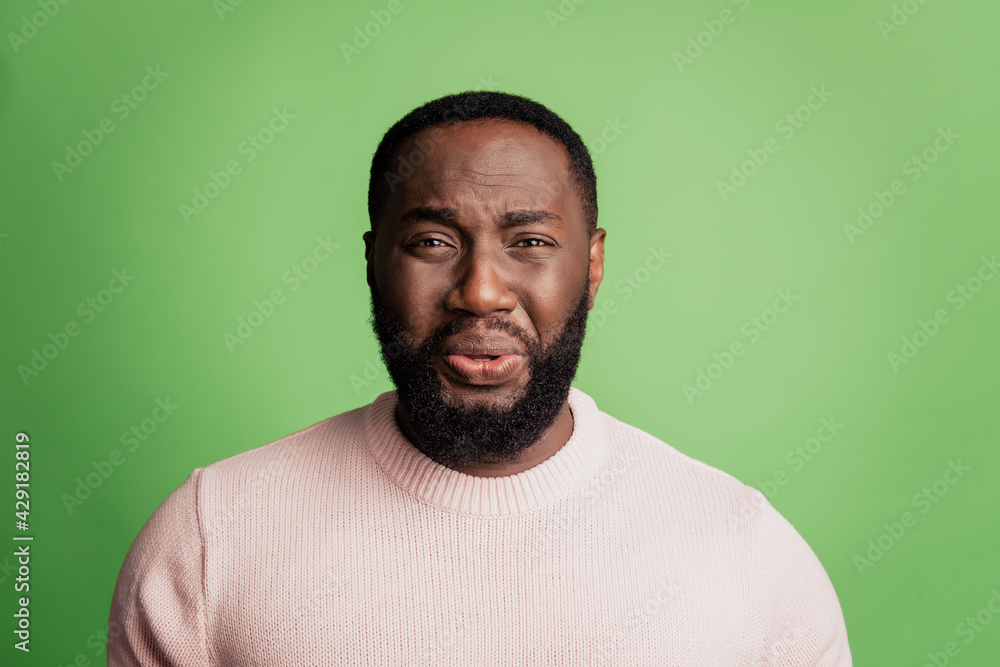 Foto de Photo of frustrated desperate man crying face grimace wear white  shirt over green background do Stock | Adobe Stock