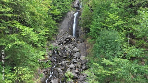 Beautiful water cascades in the mountain forest from drone