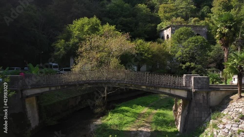 Shallow river Psyrtskha and beautiful little bridge, Abkhazia