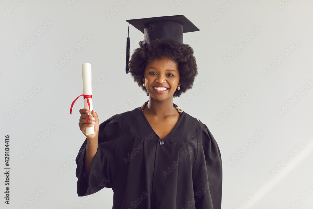 Graduation, education accomplishment. Proud african american graduate ...