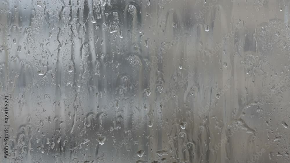 Water drops on glass from rain. Water drops on glass from rain.