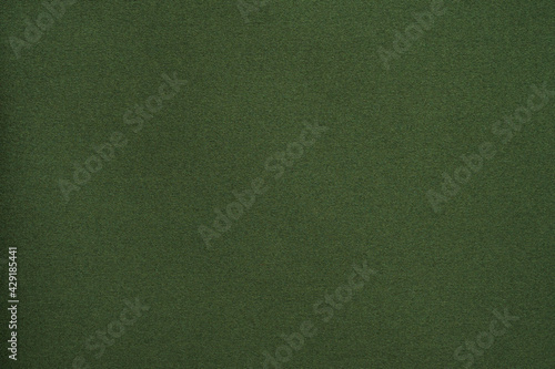 Green fabric texture background close up
