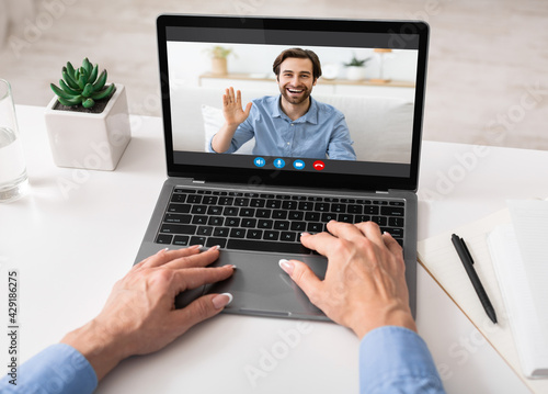 Teleconference Concept. Unrecognizable Businesswoman Making Video Call To Husband From Office