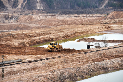 Fotografie Dozer has been recovering the landscape around the open pit