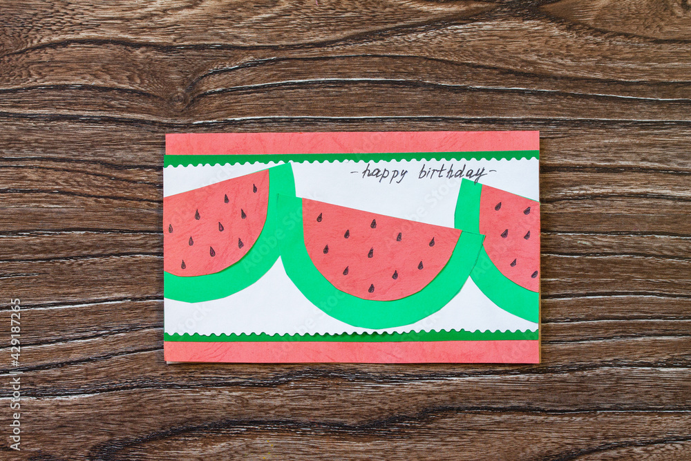 Obraz premium Summer birthday card with watermelons with birthday greetings. Handmade. Childrens creativity project, crafts for kids.