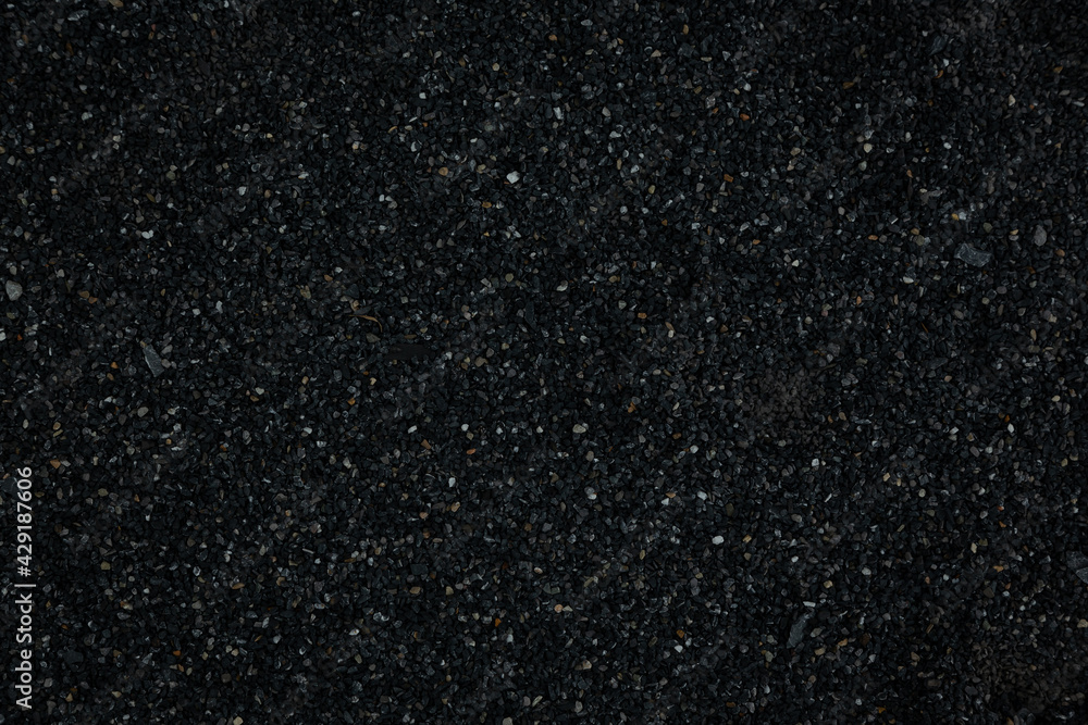 black pebbles laid on the floor as an image for making the dark black background.