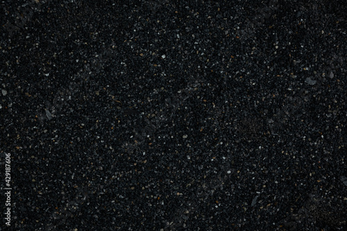 black pebbles laid on the floor as an image for making the dark black background.