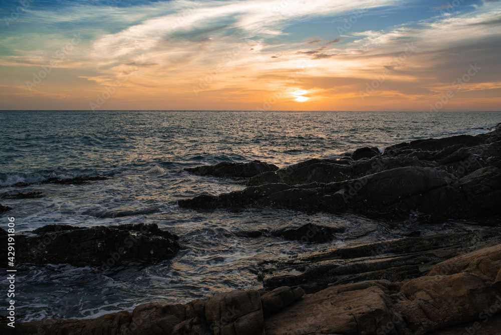 sunset over the sea with dramatic sky